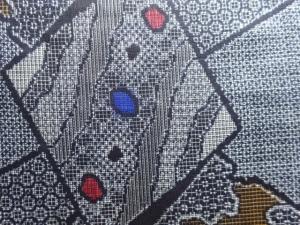 アンティーク　破れ色紙に花模様織出し本場正藍泥染大島紬着物（割り込み絣）